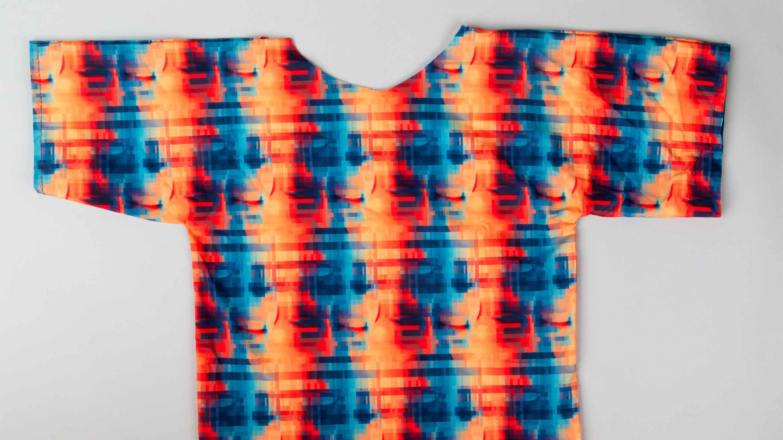 The gown laid flat, showing the anti-recognition pattern