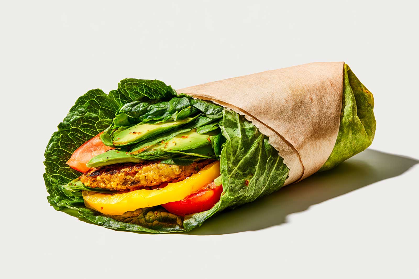 A low-glycemic sandwich wrapped for takeout on a counter