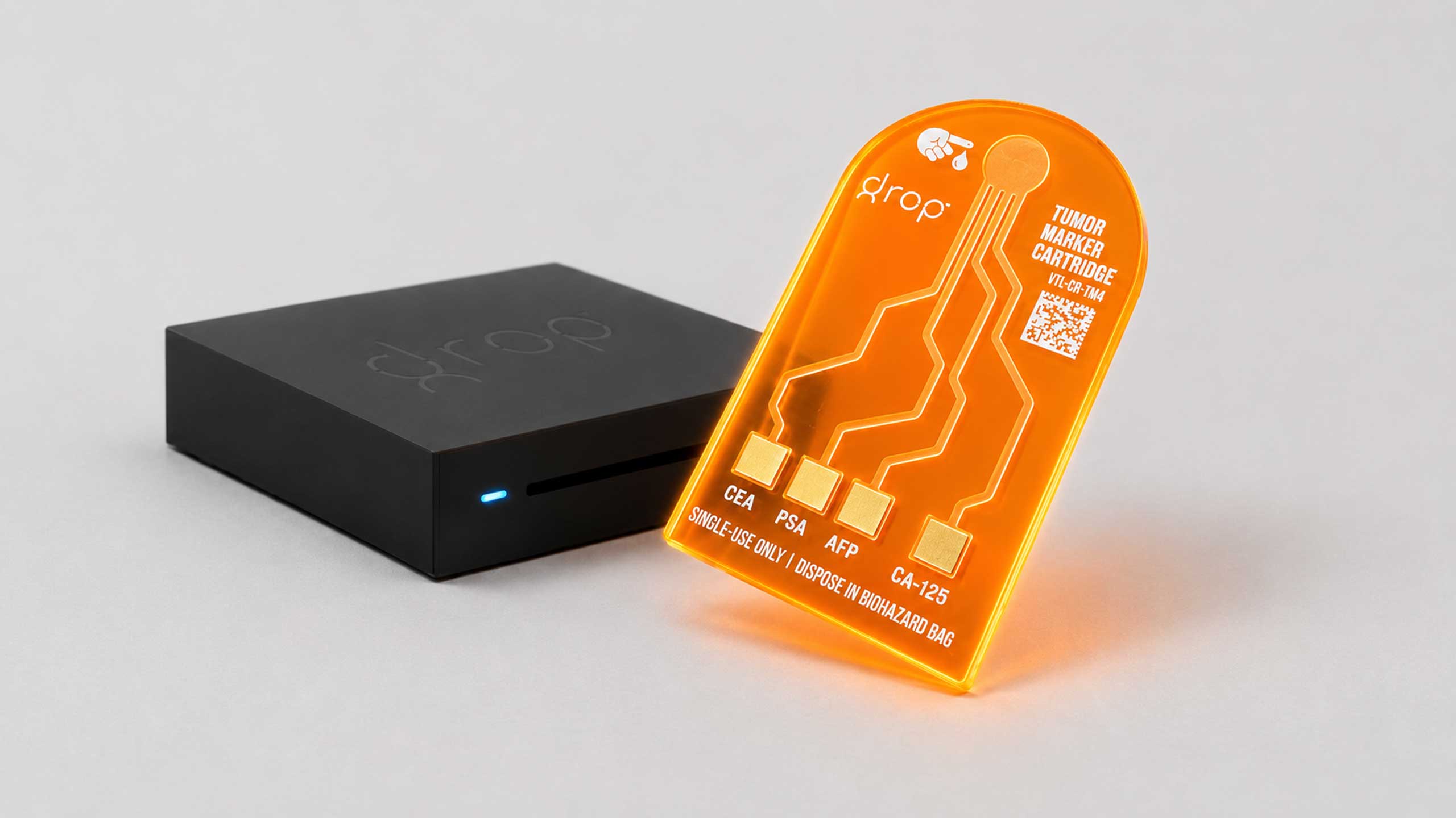 The DxROP reader and tumor marker cartridge shown together